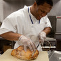 Inmate Calvin Hodge carves a turkey at the Fife and Drum Restaurant at the Northeast Correctional Center in Concord, Mass. 