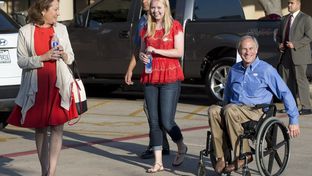 GOP gubernatorial candidate Greg Abbott, with wife Cecilia and daughter Audrey, leaves a south Austin polling place after voting early.