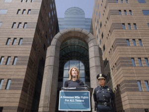 Wendy Davis, flanked by Precinct 5 Constable Beth Villarreal, made the announcement Wednesday at the Frank Crowley Criminal Courts building in Dallas.
