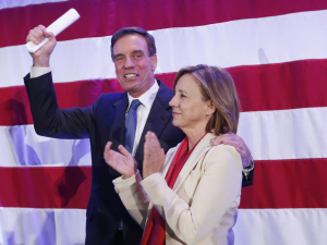 Sen. Mark Warner with his wife, Lisa Collis, during an election party in Arlington, Virginia, on Wednesday.