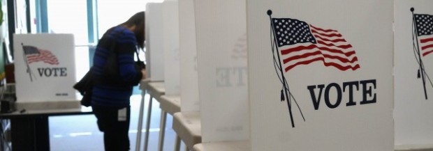 A voter fills in her ballot as she votes in the U.S. midterm elections at a polling place in Westminster, Colorado