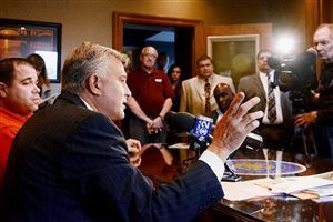  Allegheny County District Attorney Stephen Zappala talks about the fire that killed six people in McKeesport. while McKeesport Mayor Michael Cherepko, left, looks on.