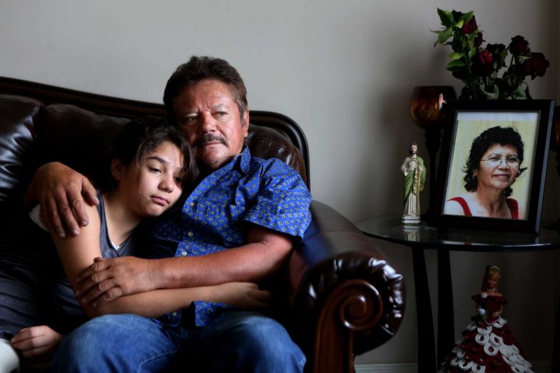 Guillermo Gomez, husband of Vilma Marenco, embraces his daughter in their home in Northeast Houston. Guillermo called his wife at least 25 times and was waiting for her to come home from her job in Humble when she was killed in April 2014 by a trucker  who ran a red light. The trucker had no insurance, records show, and the truck, which was hauling pipe, was owned by an  oilfield hauling company that had failed an audit and had no valid state license. Statewide, commercial vehicle accidents have increased more than 50 percent since 2009-2014, during the state’s on-going drilling and fracking boom.
