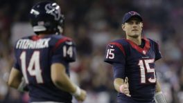 Houston Texans backup quarterback Ryan Mallett (15) congratulates quarterback Ryan Fitzpatrick (14) as he comes off the field during the second quarter of an NFL football game, Thursday, Oct. 9, 2014, in Houston. (AP Photo/Patric Schneider)