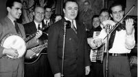 W. Lee "Pappy" O'Daniel, center, backed by Pat O'Daniel and His Hillbilly Boys, broadcast their radio show on the Texas State Network.