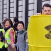 A man dressed as a nuclear waste drum stands in front of protesters holding hands on March 9, 2013 in the center of Paris. New legislation in Texas could promote the importation of more radioactive waste into Texas.