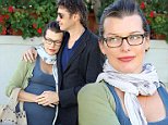 Beverly Hills, CA - Pregnant couple Milla Jovovich and Paul W. S. Anderson take a happy stroll in Beverly Hills after lunch at Il Pastaio. Milla went braless in a grey tank with a green sweater and scarf with denim jeans and sandals as she stepped out with her man for a lunch for three.\nAKM-GSI       November  5, 2014   \nTo License These Photos, Please Contact :\nSteve Ginsburg\n(310) 505-8447\n(323) 423-9397\nsteve@akmgsi.com\nsales@akmgsi.com\nor\nMaria Buda\n(917) 242-1505\nmbuda@akmgsi.com\nginsburgspalyinc@gmail.com