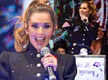 Mandatory Credit: Photo by David Fisher/REX (4233427ab)\n Cheryl Fernandez-Versini\n Oxford Street Christmas Lights switching on ceremony, London, Britain - 06 Nov 2014\n The world famous Oxford Street Christmas lights, which were newly designed last year, take form as a white winter wonderland inspired by the beauty of falling snowflakes. The 1778 baubles and blanket of bright white lights festoon the entire length of the street for a truly magical Christmas atmosphere. Nestled within the spectacular light display, the switch-on event hosted by Capital Radio presenters Lisa Snowdon and Dave Berry took place on a specially built concert stage outside John Lewis\n