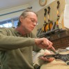 Tom Ellis has been making mandolins in Austin since the 1970s. He says the restrictions on importing and exporting tone woods have had a chilling effect on small traditional manufacturers.