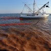 May 2010: Shrimp boat deploys oil boom around slick in Gulf of Mexico
