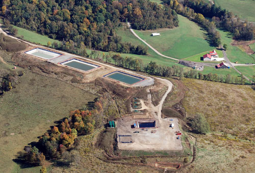Three wastewater pits and one production pit on a drilling pad