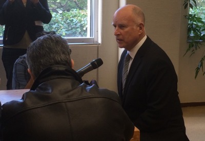 Gov.  Jerry Brown speaks to reporters in his Sacramento office. (Scott Detrow/KQED)