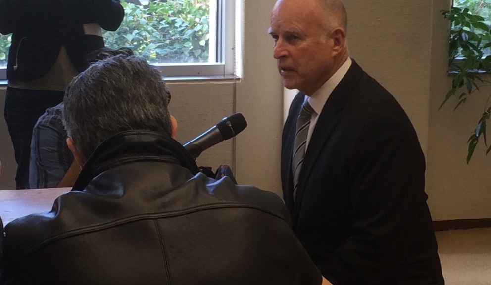 Gov.  Jerry Brown speaks to reporters in his Sacramento office. (Scott Detrow/KQED)