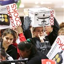  Shoppers rush to grab electric griddles and slow cookers on sale for $8 shortly after the doors opened at a J.C. Penney store in November 2012, in Las Vegas.