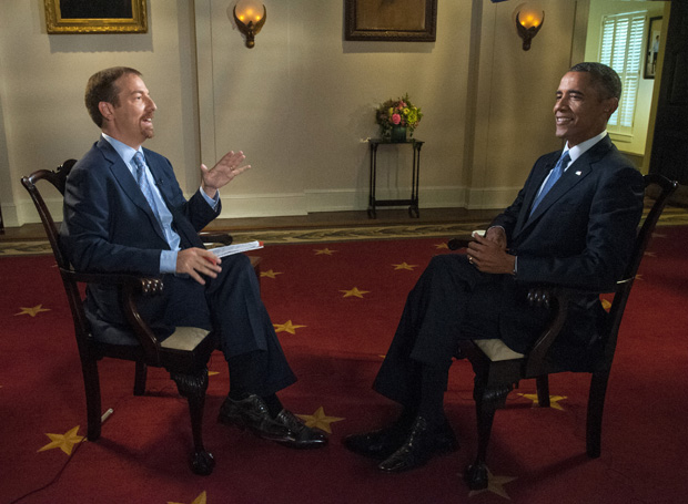 In this Sept. 6, 2014 image released by NBC, Chuck Todd, left, speaks with President Barack Obama prior to an interview for "Meet the Press" at the White House in Washington.  