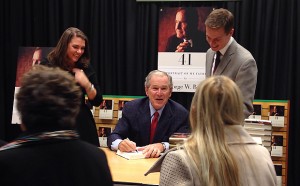 Former President George W. Bush signs copies of "41: A Portrait of My Father" Thursday morning at the Barnes & Noble store on Northwest Highway in Dallas.