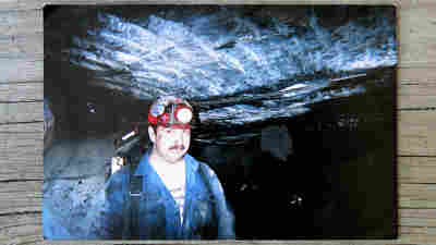 This photo of Roy Middleton working underground at the Kentucky Darby mine now sits on the mantel in the Middleton home in Harlan County, Ky. He was killed after an explosion in 2006.