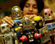 A sales assistant look at toy robots. (credit: Sion Touhig/Getty Images)