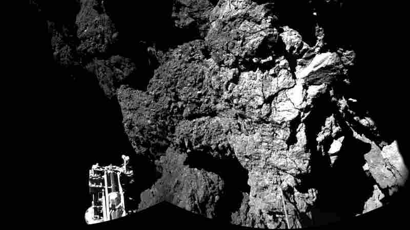 The Philae lander beamed back images showing one of its three feet on the surface of Comet 67P/Churyumov-Gerasimenko . This photo is compiled from two images; a wider version will be released later Thursday.