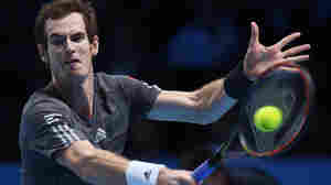 Britain's Andy Murray plays a return to Canada's Milos Raonic during their singles ATP World Tour tennis finals match Tuesday at the O2 arena in London.