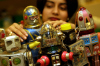 A sales assistant look at toy robots. (credit: Sion Touhig/Getty Images)