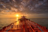 A tanker sails in the morning sun. (Louis Vest, Getty Images)