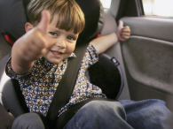 A young boy gestures from his new child seat. (credit: Bruno Vincent/Getty Images)