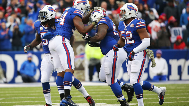 Kyle Williams #95 and Marcell Dareus #99 of the Buffalo Bills celebrate a sack against the Kansas City Chiefs during the first half at Ralph Wilson Stadium on November 9, 2014 in Orchard Park, New York.  (Photo by Tom Szczerbowski/Getty Images)