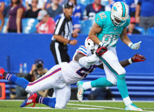 ORCHARD PARK, NY - SEPTEMBER 14: Brian Hartline #82 of the Miami Dolphins has a pass broken up by Da'Norris Searcy #25 of the Buffalo Bills during the second half at Ralph Wilson Stadium on September 14, 2014 in Orchard Park, New York.