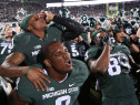 EAST LANSING, MI - OCTOBER 25: Mike Sadler #3 and Lawrence Thomas #8 of the Michigan State Spartans celebrates a win over the Michigan Wolverines at Spartan Stadium on October 25 , 2014 in East Lansing, Michigan. The Spartans defeated the Wolverines 35-11. (Photo by Leon Halip/Getty Images)