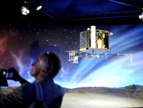 A man stands near a model of the European Space Agency's (ESA) robot craft Philae as he visits the Cite de l'espace (Space City) in Toulouse, southern France, on November 12, 2014, on the day Philae began a 20-kilometre (12-mile) descent toward the Churyumov-Gerasimenko comet after being launched from the space probe Rosetta, following a ten year journey. Europe's Rosetta spacecraft made contact with its robot craft Philae soon after the lander embarked on November 12 on a solo, seven-hour descent to a comet, ground controllers said. Astrophysicists hope Philae will unlock knowledge about the origins of the Solar System and even life on Earth, which some believe may have started with comets 'seeding' the planet with life-giving carbon molecules and water.  (Remy Gabalda/AFP/Getty Images)