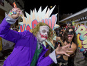 In this Saturday, Oct. 25, 2014, photo provided by the Florida Keys New Bureau, revelers dressed as comic-book villains proceed down Duval Street Saturday, Oct. 25, 2014, in Key West, Fla., during the 3Wishes.com Fantasy Fest Parade. The parade was the highlight event of the island city's 10-day costuming and masking festival that concludes Sunday, Oct. 26. This year's Fantasy Fest theme is "Animeted Dreams & Adventures," inspired by Japanese anime and other forms of animation.  (Rob O'Neal/Florida Keys News Bureau/HO)