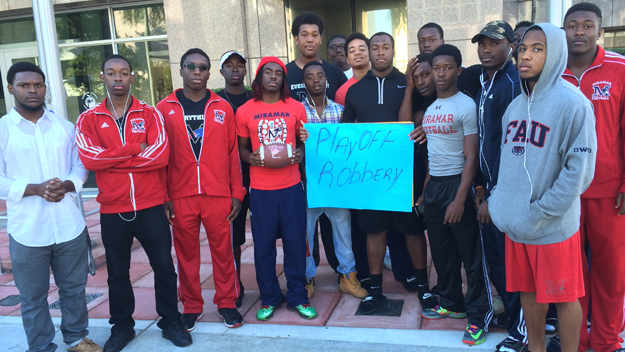 Members of the Miramar High Patriots and their parents protest outside the Broward County School Board building.  (Source: Gaby Fleischman/CBS4)