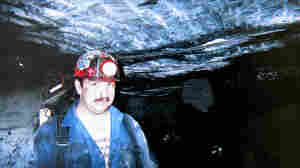 This photo of Roy Middleton working underground at the Kentucky Darby mine now sits on the mantel in the Middleton home in Harlan County, Ky. He was killed after an explosion in 2006.