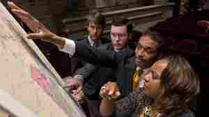 State Reps. Barry Moore, Joe Hubbard, Rod Scott and Merika Coleman study a map of the proposed redistricting plan in May 2012 following a meeting of the Legislative Committee on Reapportionment at the Alabama Statehouse in Montgomery, Ala.