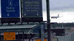 A plane arrives at New York's John F. Kennedy International Airport. Since Ebola screenings began Saturday, none of the 91 passengers identified as having an increased risk of an Ebola infection was found to be sick, the CDC says.