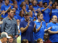 Jason Witten and Tony Romo of the Dallas Cowboys watch a game between the San Antonio Spurs and the Dallas Mavericks in Game Four of the Western Conference Quarterfinals during the 2014 NBA Playoffs at American Airlines Center on April 28, 2014 in Dallas, Texas.  (Photo by Ronald Martinez/Getty Images)