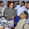 Dr. R.K. Gupta, center, the doctor who conducted sterilization procedures after which at least 13 dozen women died, is interrogated by police in Bilaspur, India, on Thursday.