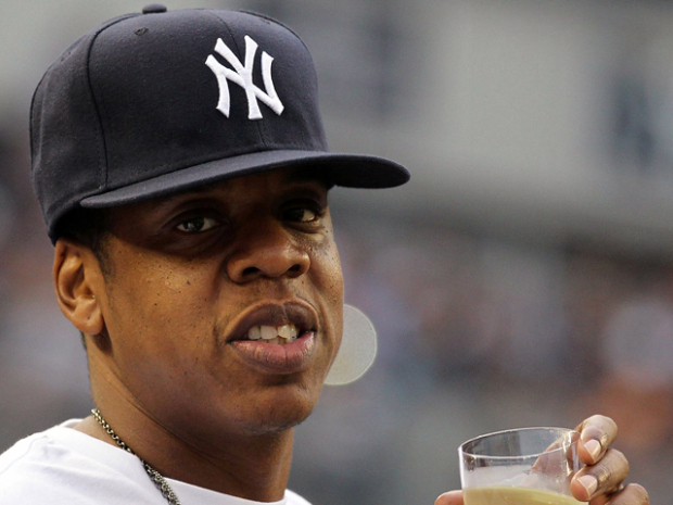 Rapper Jay-Z watches a game between the New York Yankees and the Kansas City Royals on July 23, 2010 at Yankee Stadium in the Bronx borough of New York City.