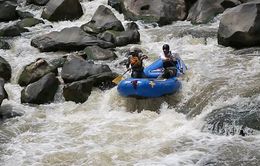 Garret Schooley, left, and Neil Cheesewright take a two man raft down the Upper Box of the Rio Grande Gorge.