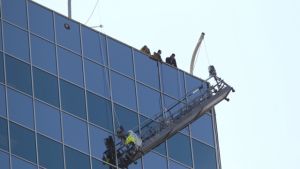 The Houston Fire Department has begun a rescue of a man on a tall-building scaffold. The "high angle" rescue was reported at noon at the Phoenix Tower in the 3200 block of Southwest Freeway. The man is three floors from the roof of the multi-story building.
