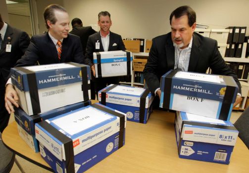 Jared Woodfill, left, David Welch, right, and others with a group seeking to repeal Houston's equal rights ordinance delivered boxes of signatures to the office of the Houston city secretary on July 3. Photo: Melissa Phillip, Staff / © 2014  Houston Chronicle