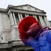 A Paddington Bear sculpture sits in front of the Bank of England in London.