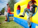 Everett Morrison, 7, plays in an inflatable obstacle course while his parents Brian and Leslie Morrison watch other children with Texas Child Protective Services at an adoption festival sponsored by the Pearland Rotary on Saturday, Nov. 8, 2014 at the Silverlake Clubhouse in Pearland, Texas. The Morrisons said they always wanted to adopt a child and are looking to find one or two siblings to raise with their two biological children.