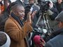 Benjamin Crump, left, attorney for the family of Michael Brown, speaks to reporters outside the Buzz Westfall Justice Center on Nov. 13.