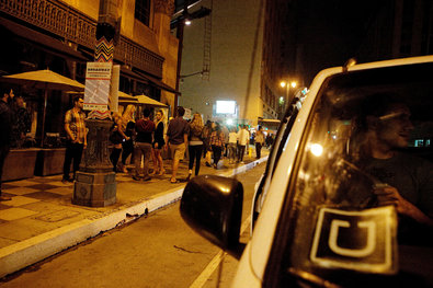 A car with an Uber sticker waits to receive customers leaving the Ace Hotel Downtown Los Angeles on a Saturday evening.