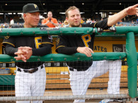 Evan Meek #47 and bench coach Jeff Banister #17 of the Pittsburgh Pirates  (Photo by Jared Wickerham/Getty Images)