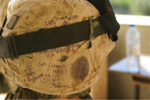 The helmet of a Marine from the First Battalion, Eighth Marine Regiment, bears the names of brethren killed in action during the battle of Falluja.