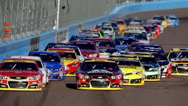 Kevin Harvick, driver of the #4 Budweiser Chevrolet, and Jeff Gordon, driver of the #24 Axalta Chevrolet, lead the field in a restart during the NASCAR Sprint Cup Series Quicken Loans Race for Heroes 500 at Phoenix International Raceway on November 9, 2014 in Avondale, Arizona. (credit: Matt Sullivan/Getty Images)
