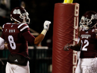Fred Ross #8 of the Mississippi State Bulldogs celebrates with Robert Johnson #12 after he scores a touchdown against the Arkansas Razorbacks in the second half at Davis Wade Stadium on November 1, 2014 in Starkville, Mississippi. (Photo by Butch Dill/Getty Images)